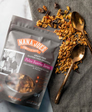 Load image into Gallery viewer, Nana Joes Granola Paleo Sunrise Cranberry blend granola spilled on a napkin with two spoons
